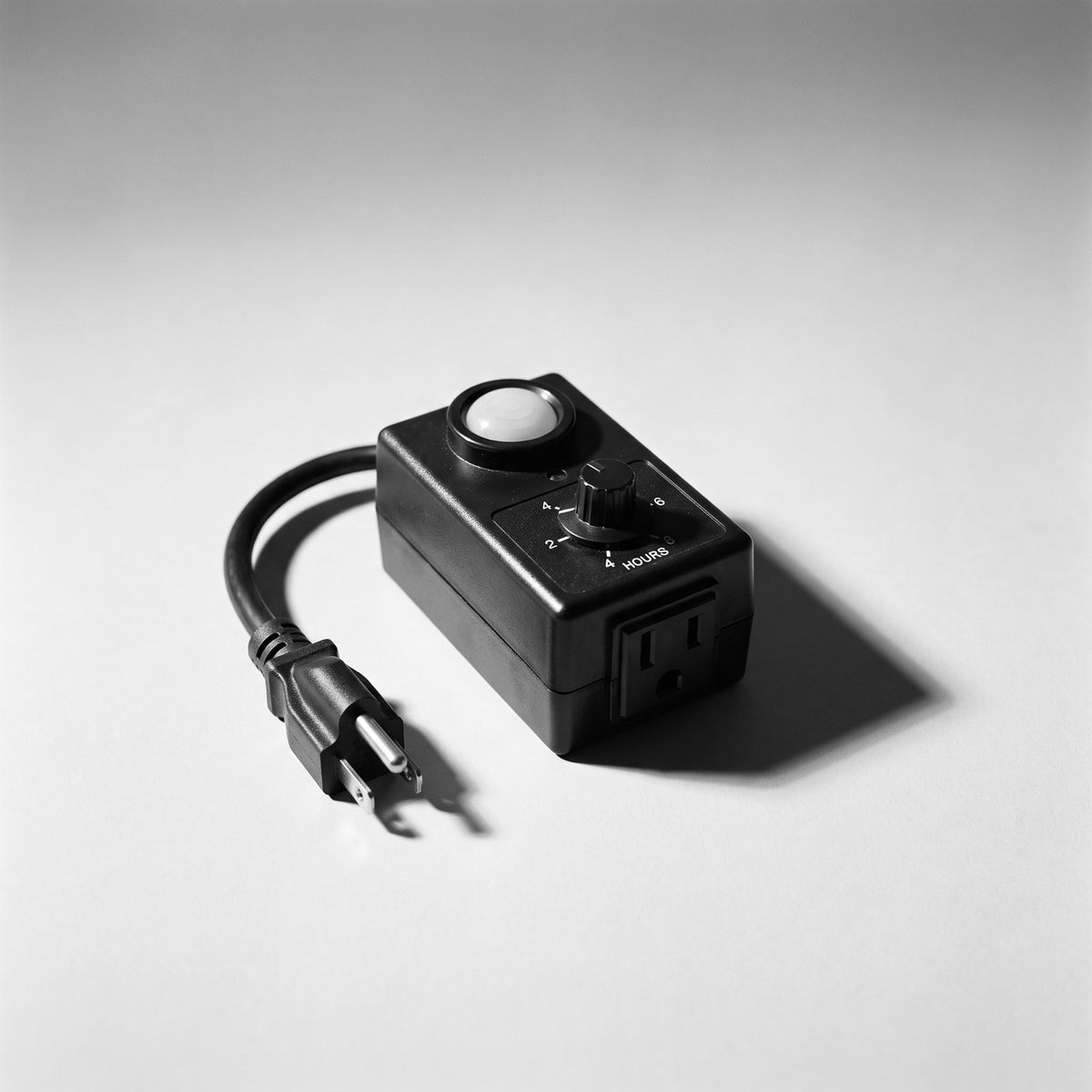 Outdoor photocell timer with light sensor, hour dial and outlet